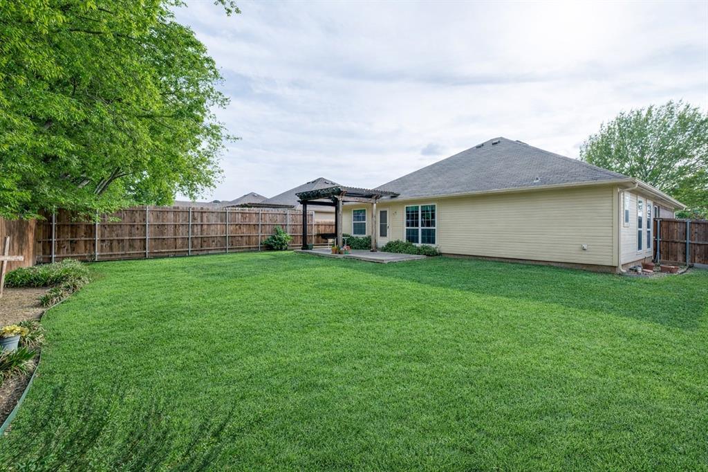 1012 Barbara Street Denton, TX 76209 - Photo 21 of 23 a house view with a garden space