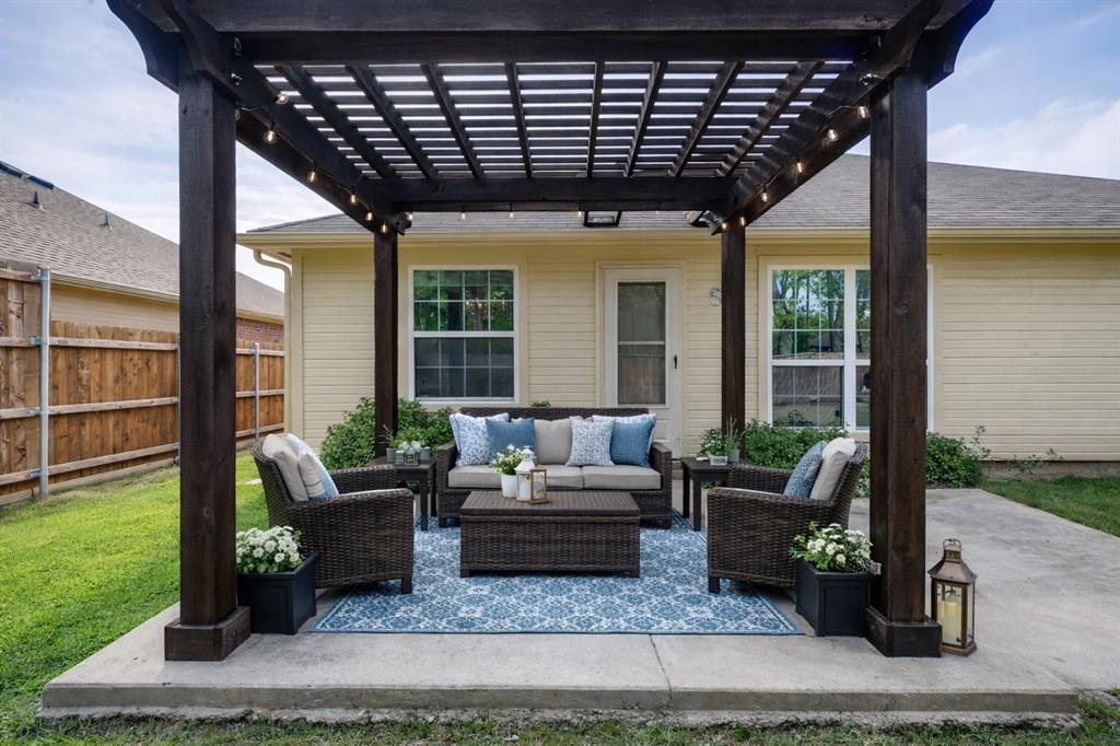 1012 Barbara Street Denton, TX 76209 - Photo 22 of 23 a living room with patio furniture and garden