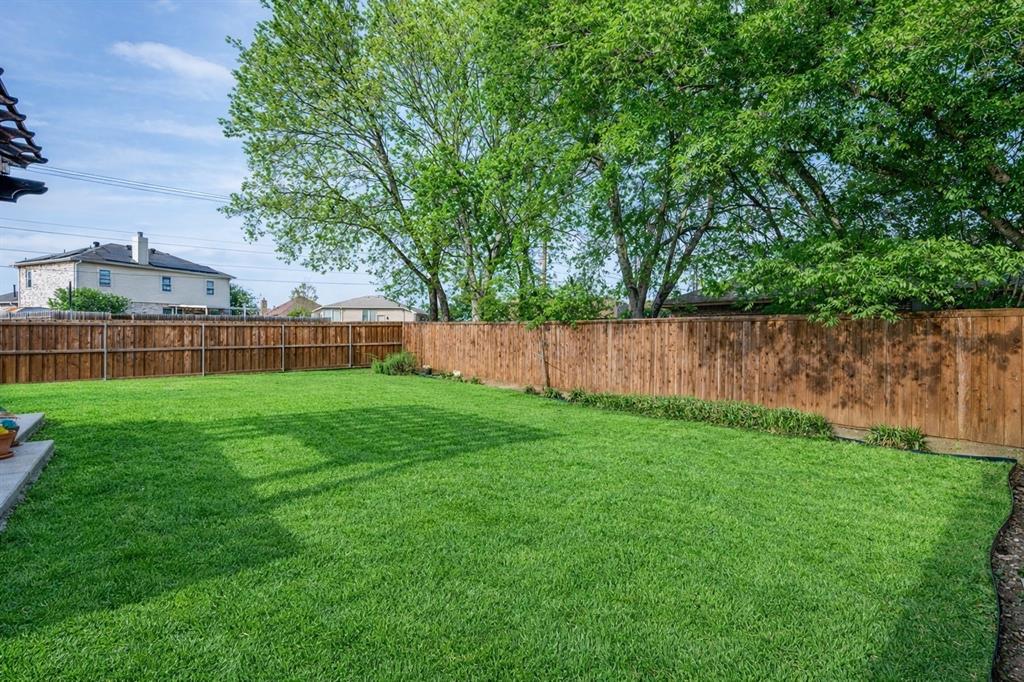 1012 Barbara Street Denton, TX 76209 - Photo 23 of 23 a view of yard with green space and wooden fence
