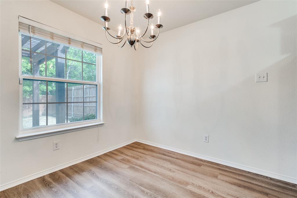 1012 Barbara Street Denton, TX 76209 - Photo 8 of 23 a view of empty room with wooden floor and fan