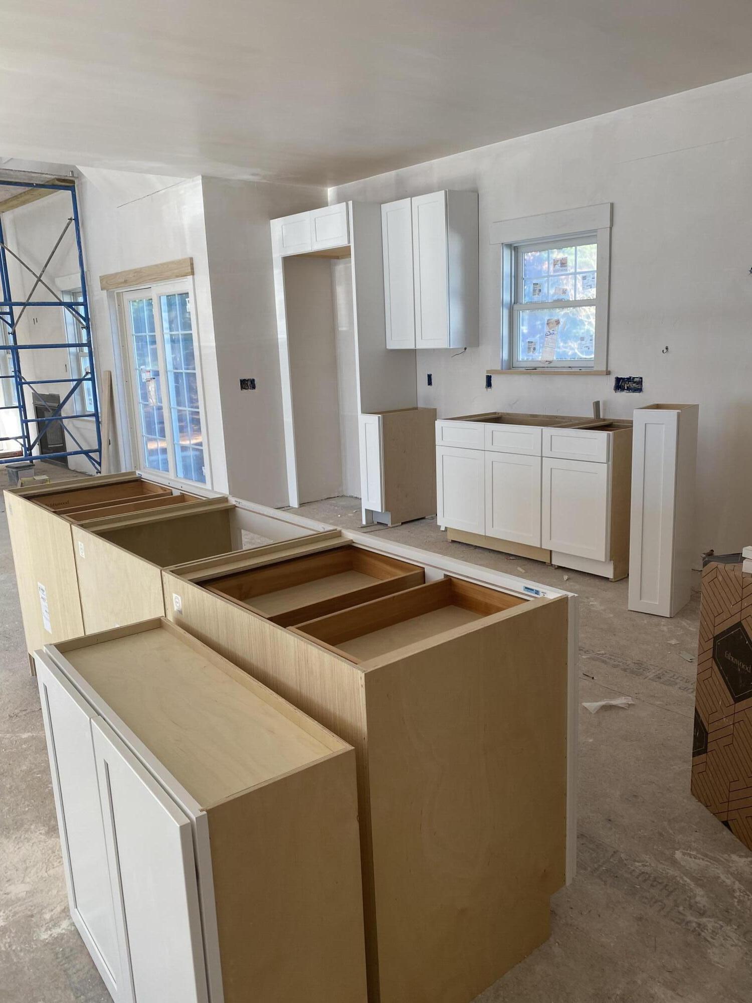 33 Running Light Way Mashpee, MA 02649 - Photo 4 of 11 a kitchen that has a sink and a stove in it