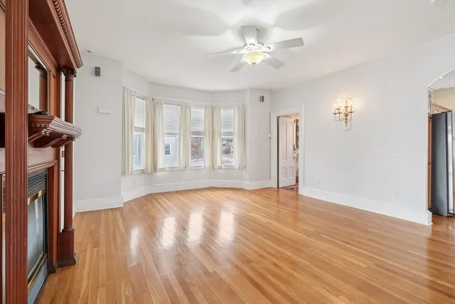 a kitchen with stainless steel appliances granite countertop a stove a sink and a window