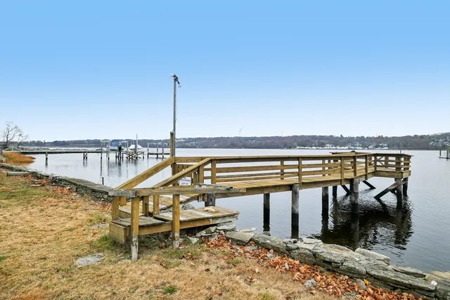 a view of a swimming pool with outdoor seating space