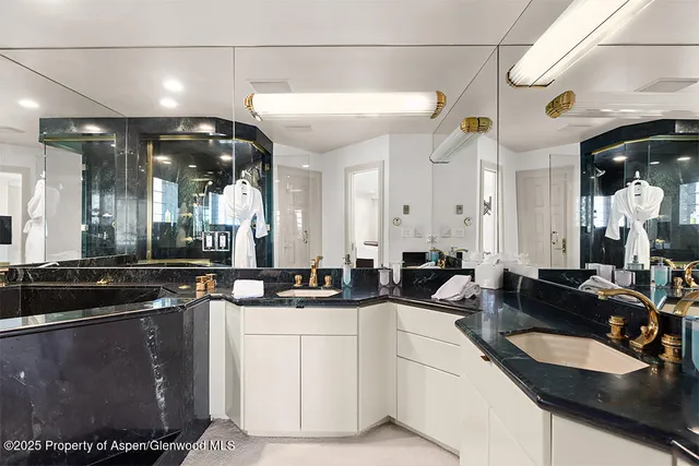 a large kitchen with a sink and cabinets