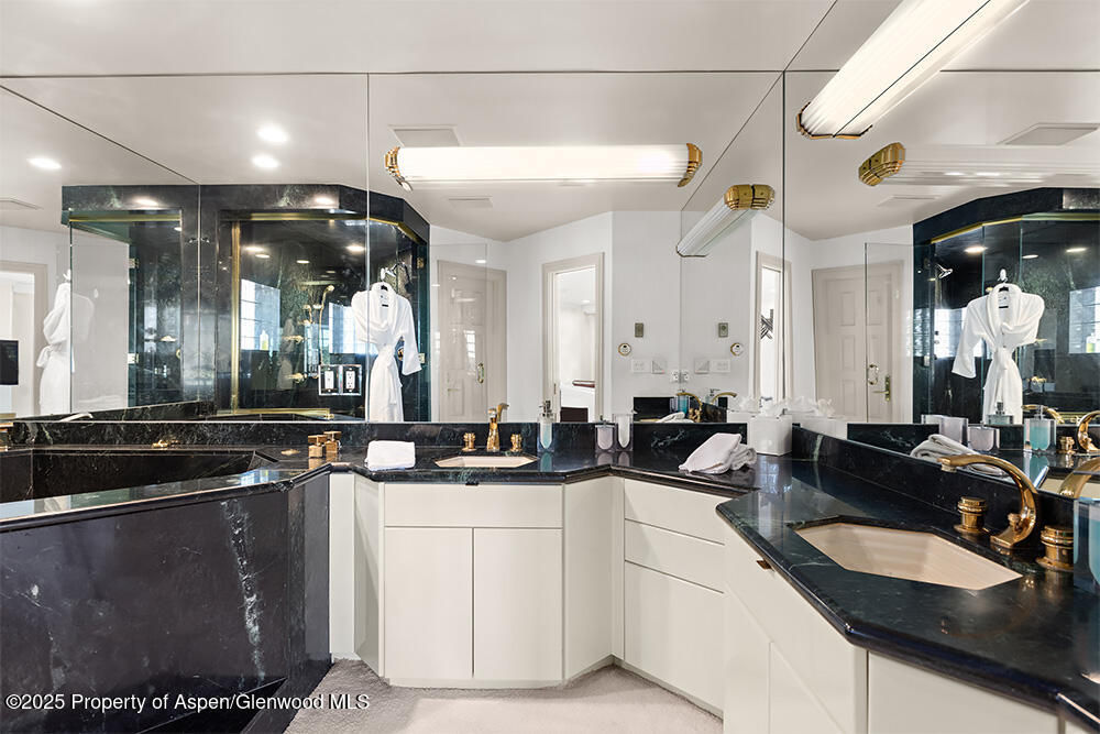 208 South Spring Street, Unit 1 Aspen, CO 81611 - Photo 14 of 29 a large kitchen with a sink and cabinets