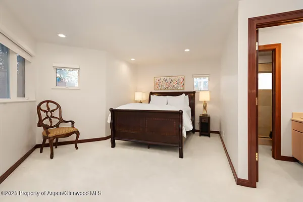 a bedroom with furniture and a window
