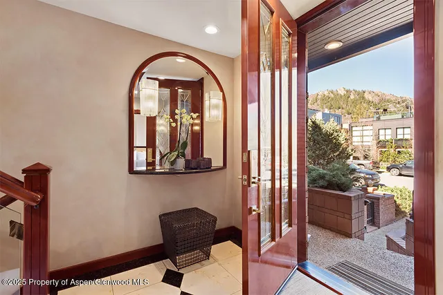 a view of a balcony with furniture and floor to ceiling window