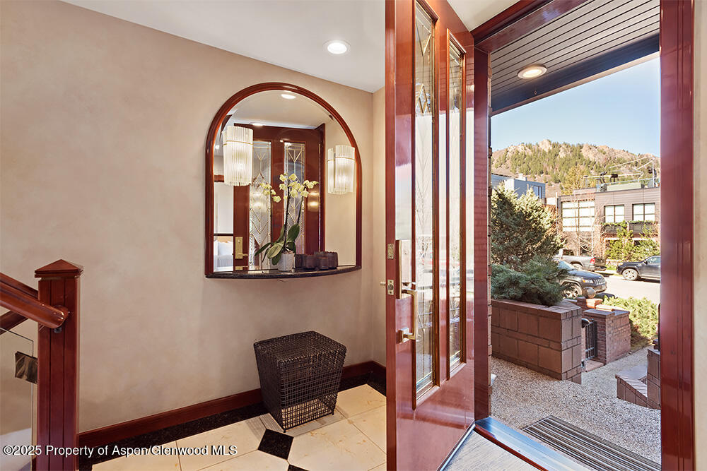 208 South Spring Street, Unit 1 Aspen, CO 81611 - Photo 24 of 29 a view of a balcony with furniture and floor to ceiling window