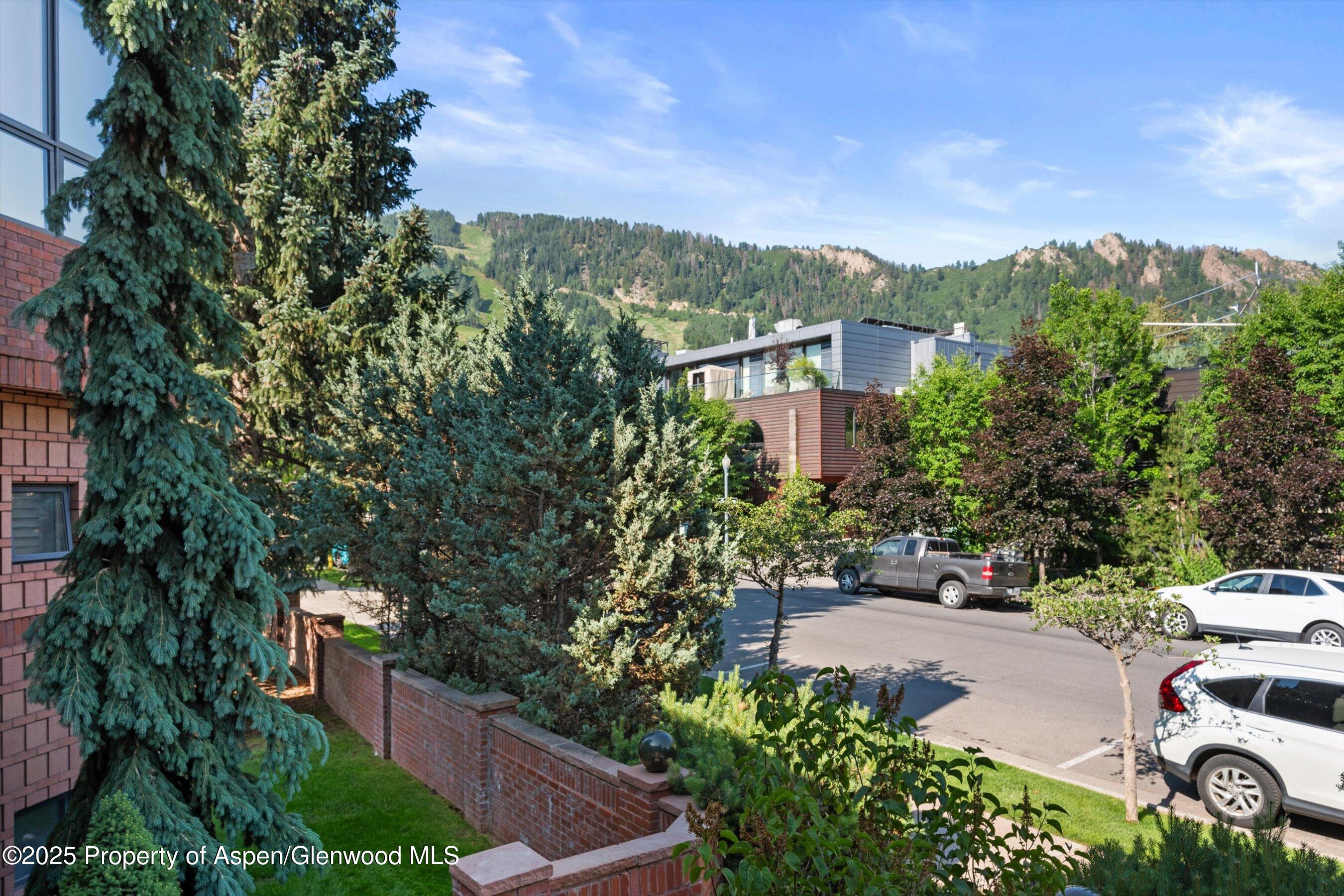 208 South Spring Street, Unit 1 Aspen, CO 81611 - Photo 25 of 29 a view of a city with tall buildings