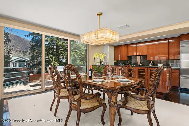 a view of a dining room with furniture window and outside view