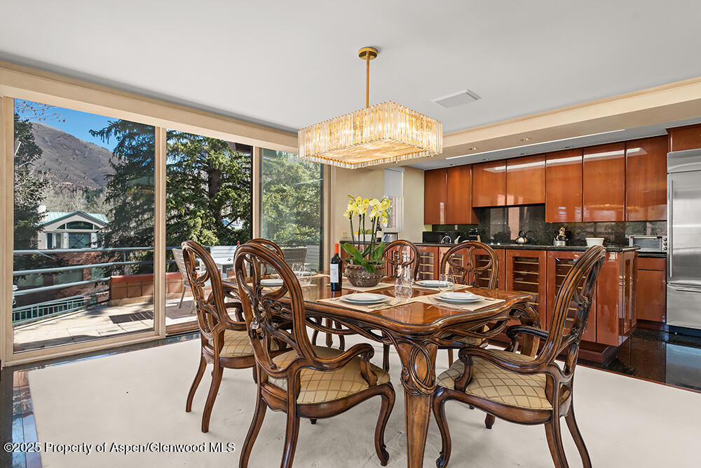 208 South Spring Street, Unit 1 Aspen, CO 81611 - Photo 5 of 29 a view of a dining room with furniture window and outside view