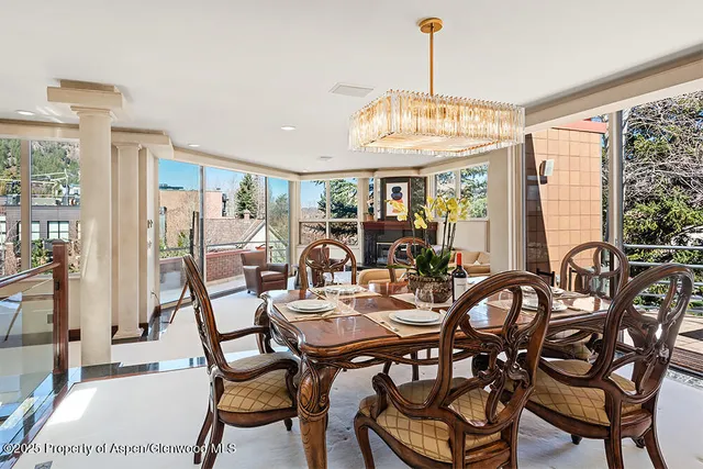 a view of a dining room with furniture window and outside view