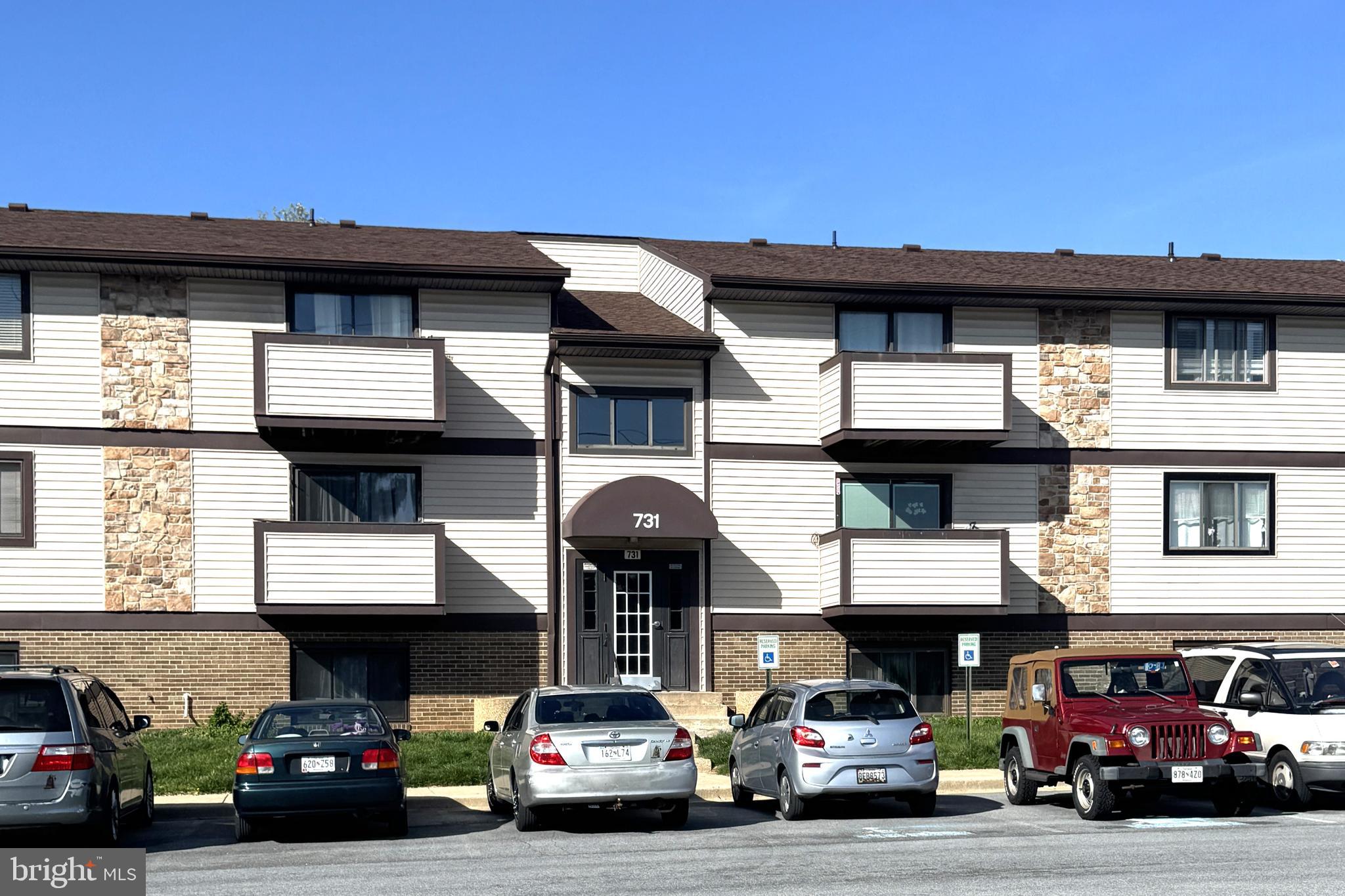 731 Heather Ridge Drive, Unit F Frederick, MD 21702 - Photo 5 of 7 a view of a car parked in front of a building