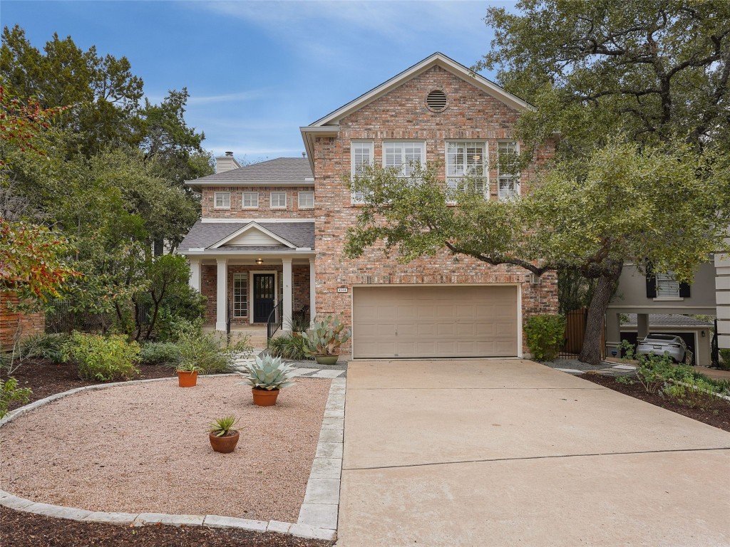 a front view of a house with yard