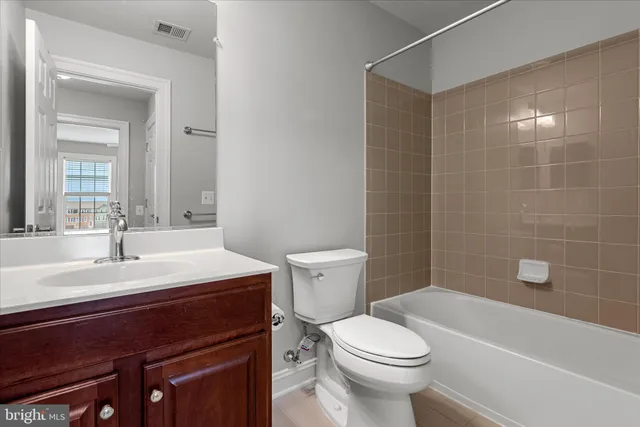 a bathroom with a sink a toilet and a bathtub