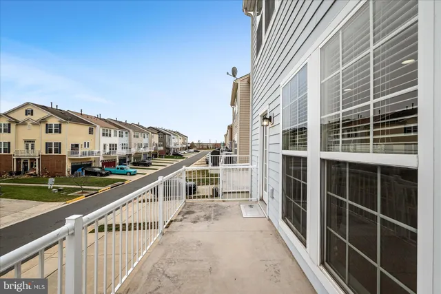 a view of a city with tall buildings and a big yard