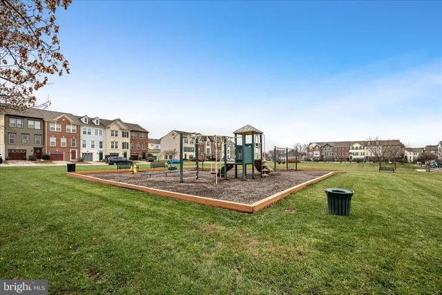 an aerial view of residential houses with city view