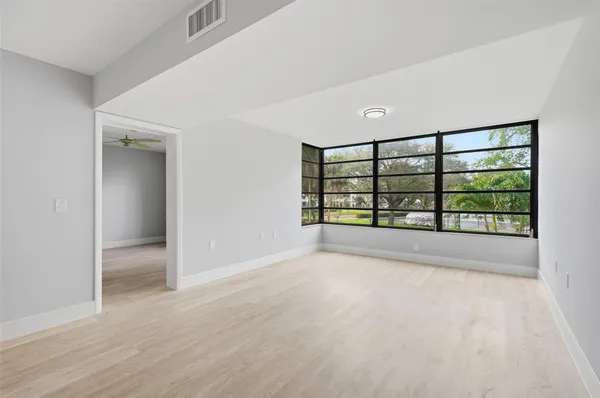 a view of an empty room with a window