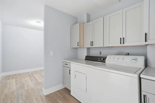 a view of storage and utility room with washer and dryer