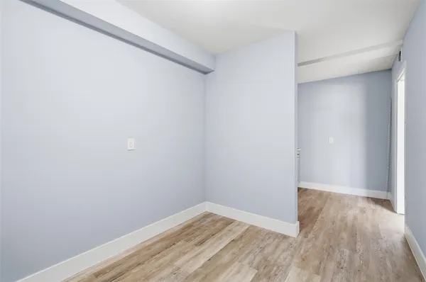 a view of small space with wooden floor