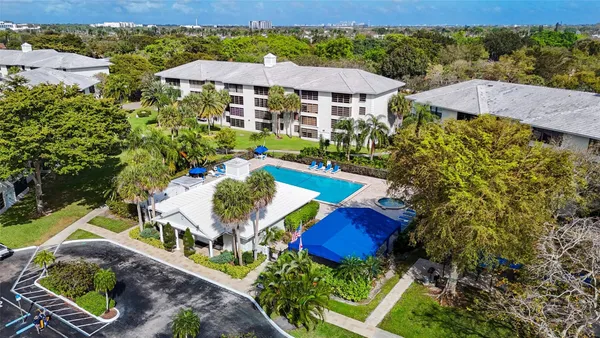 an aerial view of a house with yard swimming pool and outdoor seating