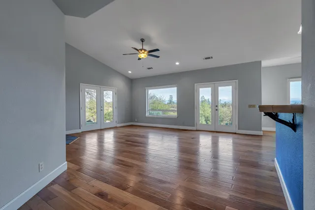 a kitchen with stainless steel appliances granite countertop a stove and a microwave