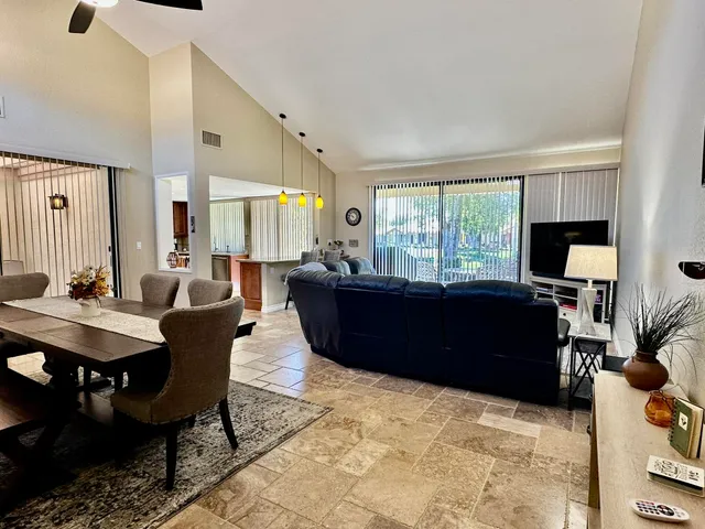 a living room with furniture window and wooden floor