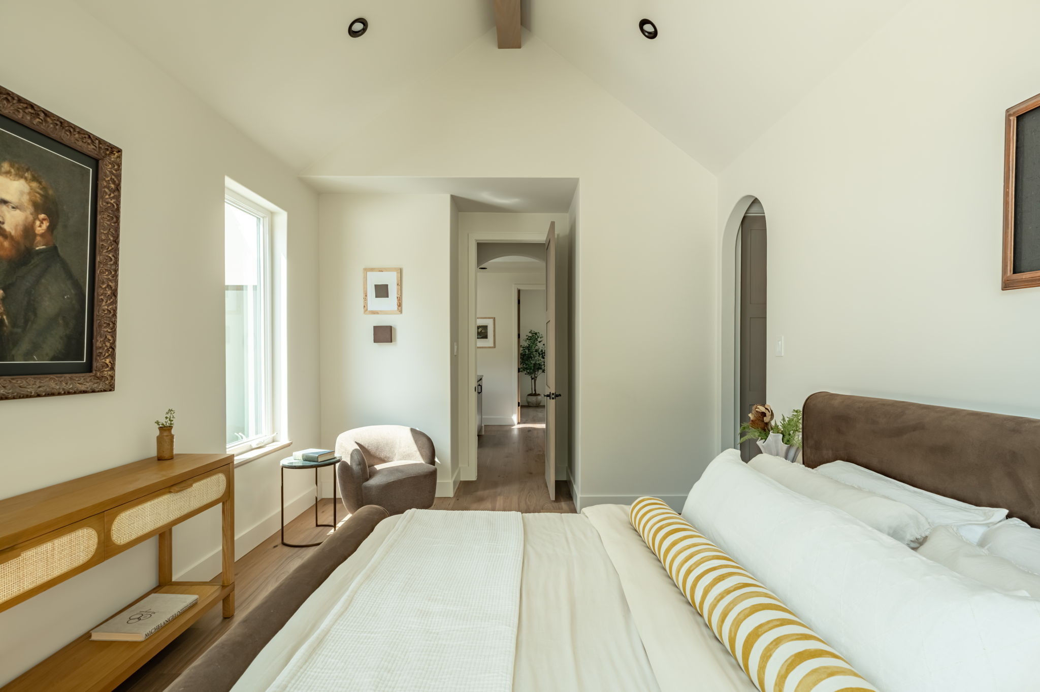 4713 Bolm Road Austin, TX 78702 - Photo 26 of 40 Bedroom featuring vaulted ceiling, recessed lighting, wood-finish flooring, and an arched doorway