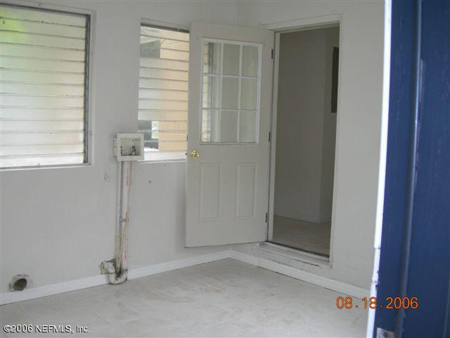 1840 Prospect Street Jacksonville, FL 32208 - Photo 9 of 9 an empty room with windows