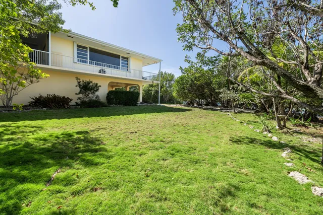 a living room with furniture and a gym equipment