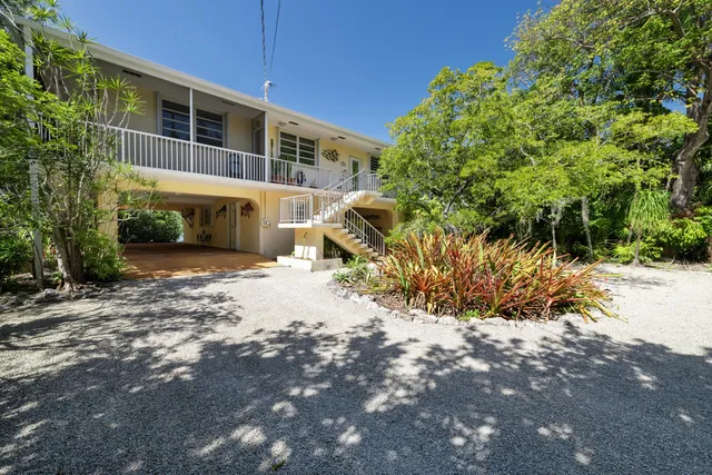 a view of a swimming pool and outdoor seating