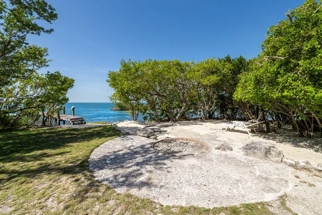 a bedroom with furniture and a large window