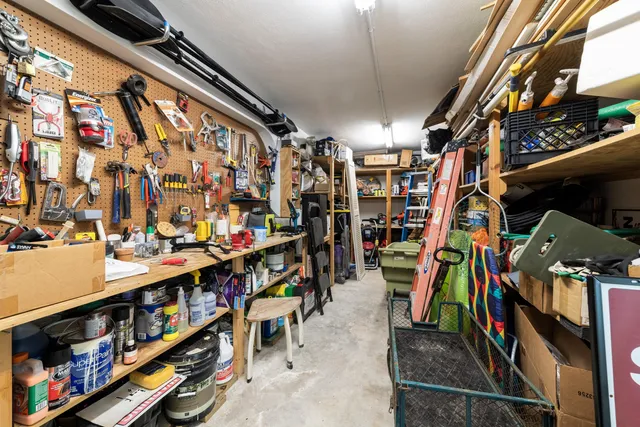 a kitchen with cabinets appliances a sink and a window