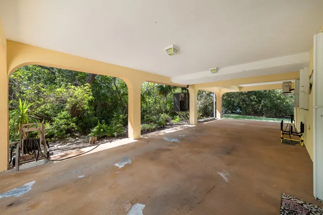 a living room with stainless steel appliances kitchen island granite countertop furniture and a kitchen view
