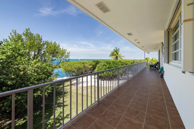 a kitchen with sink and chairs