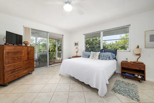 an aerial view of a residential houses with outdoor space and street view