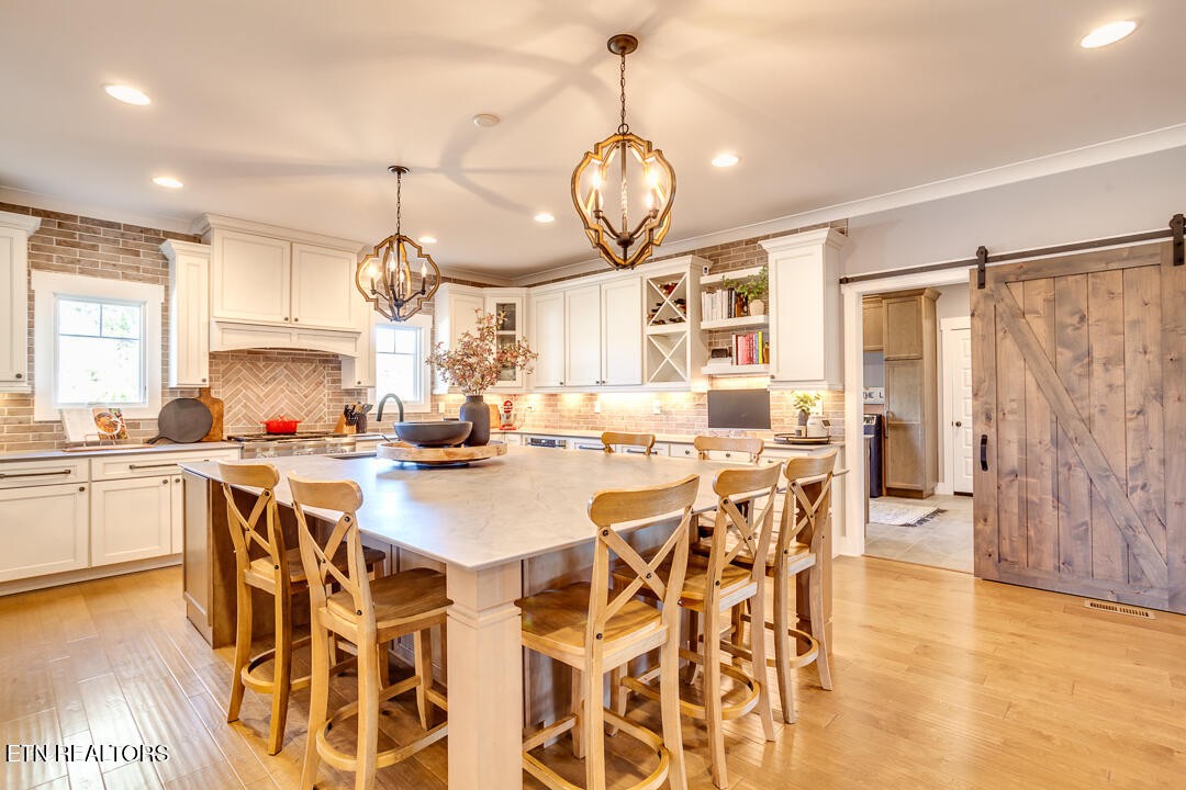 6015 Cate Road Powell, TN 37849 - Photo 23 of 60 a large kitchen with a table and chairs