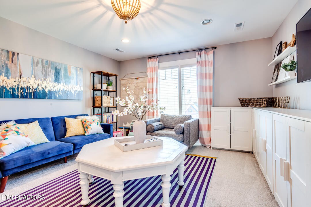 6015 Cate Road Powell, TN 37849 - Photo 39 of 60 a living room with furniture a flat screen tv and a large window