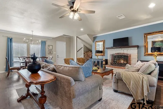 a living room with furniture and a fireplace