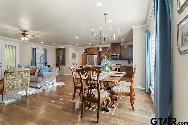 a view of a dining area with furniture and a chandelier