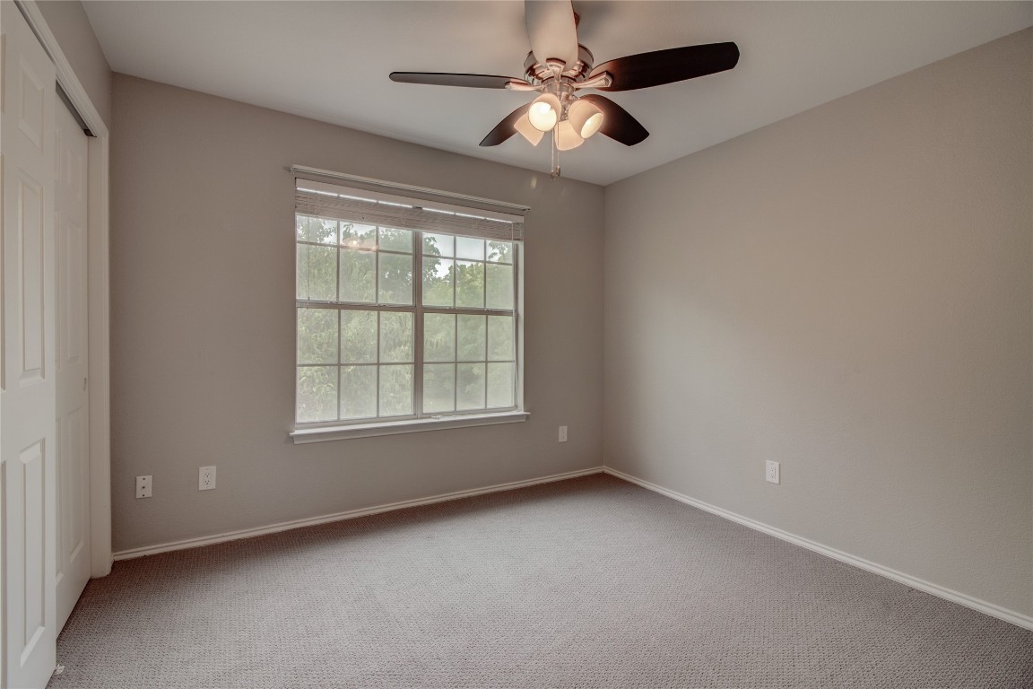 202 South College Street, Unit 3 Georgetown, TX 78626 - Photo 20 of 36 an empty room with a window and a fan