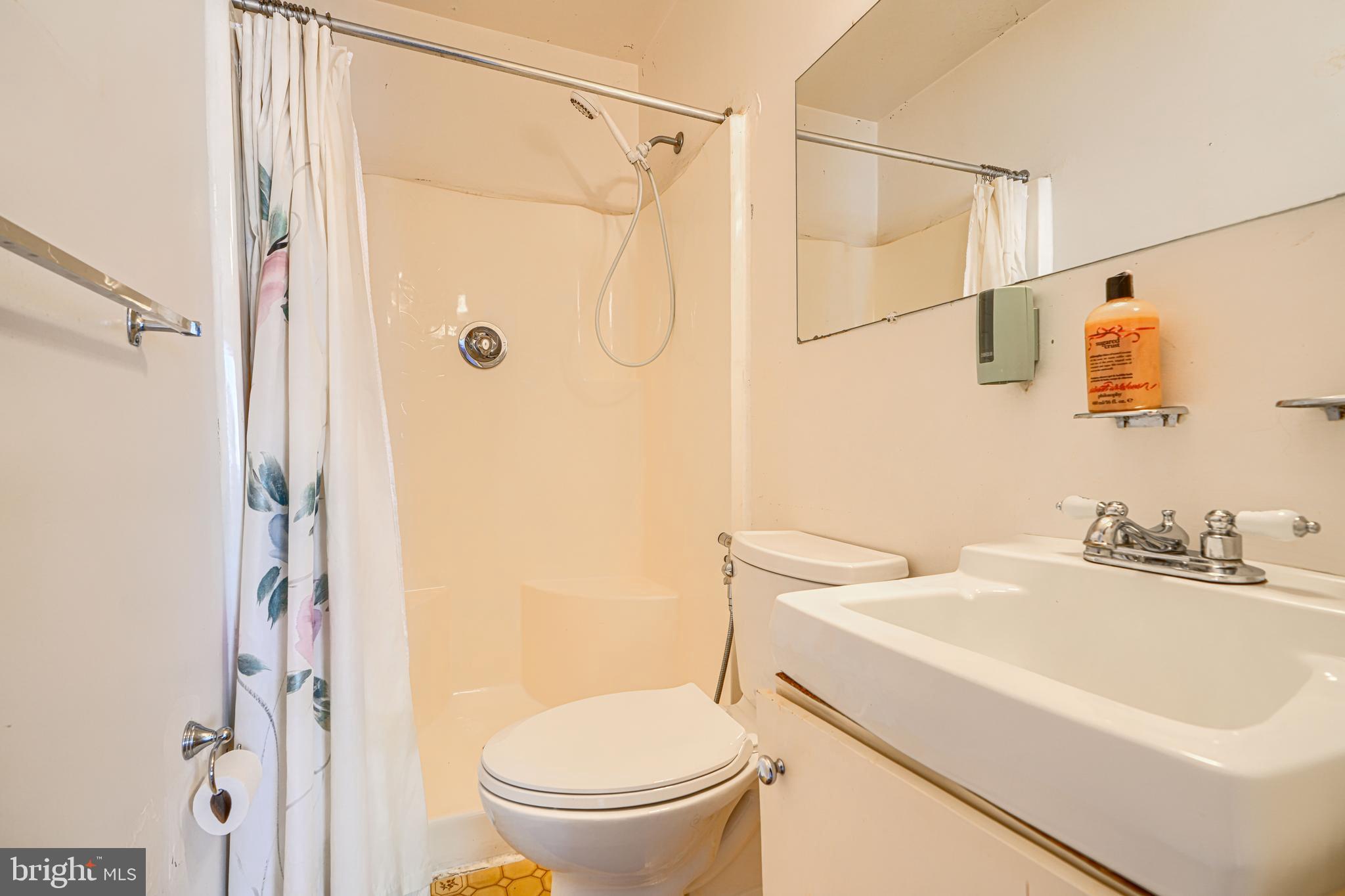 2 Romanoff Court Baltimore, MD 21234 - Photo 16 of 34 a bathroom with a sink a toilet and shower