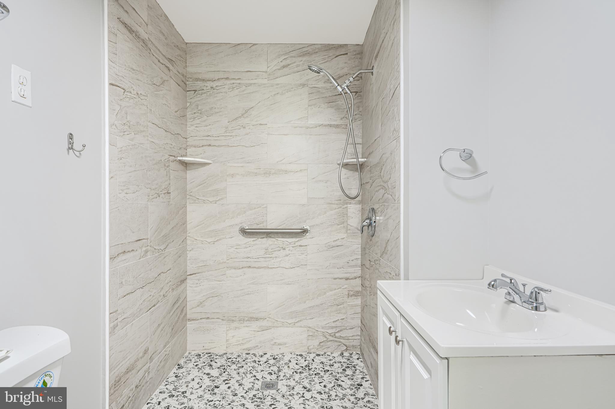 2 Romanoff Court Baltimore, MD 21234 - Photo 26 of 34 a bathroom with a sink shower and a toilet