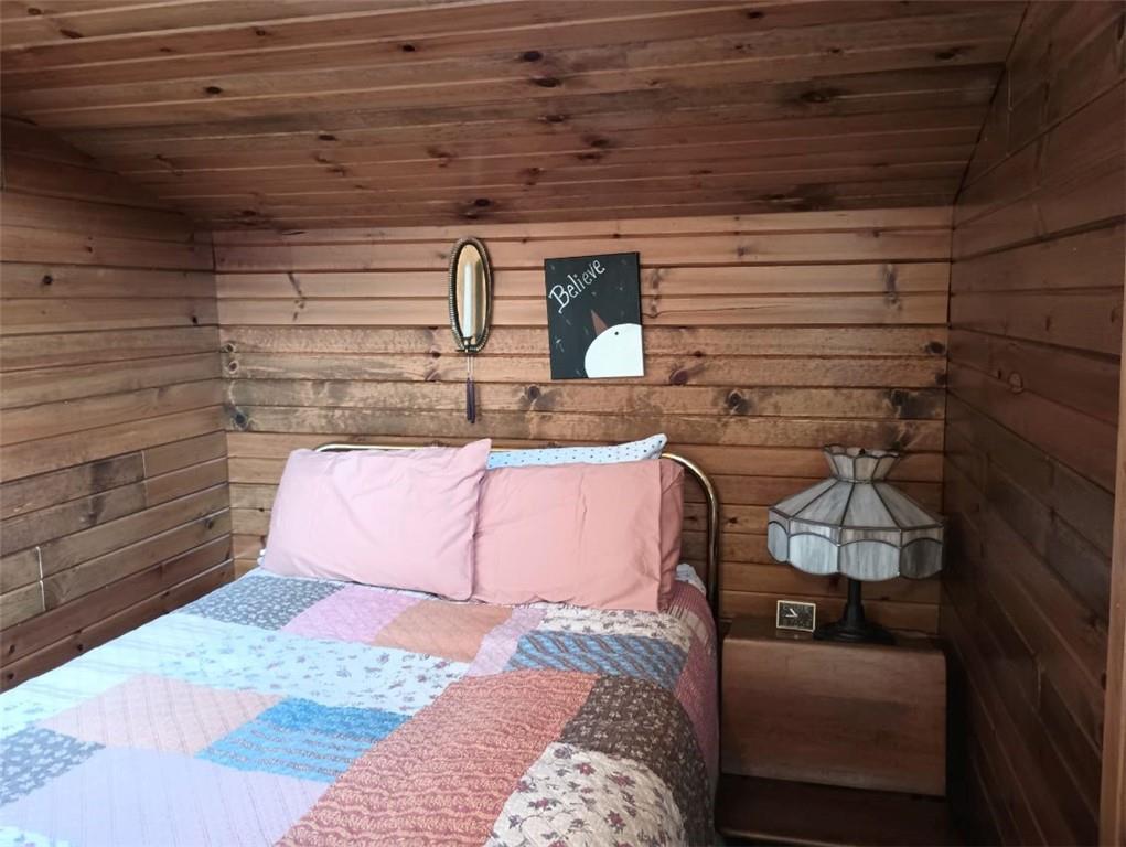 8473 South Lake Road Jamestown, PA 16134 - Photo 15 of 21 a bed with white sheets and pillows