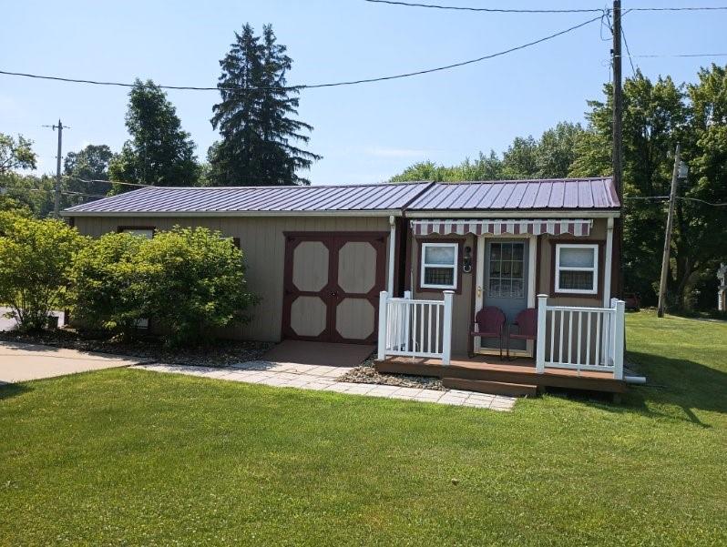 8473 South Lake Road Jamestown, PA 16134 - Photo 19 of 21 a front view of a house with garden