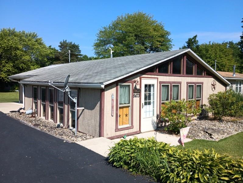 8473 South Lake Road Jamestown, PA 16134 - Photo 2 of 21 a house with trees in the background