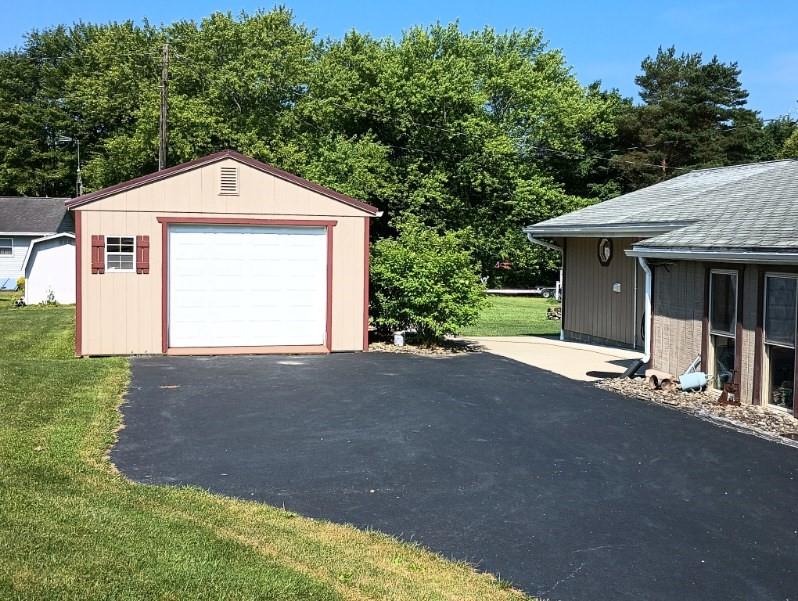 8473 South Lake Road Jamestown, PA 16134 - Photo 3 of 21 a front view of a house with a yard and garage