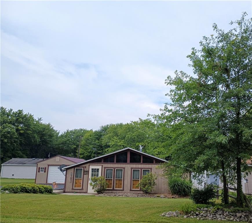 8473 South Lake Road Jamestown, PA 16134 - Photo 4 of 21 a view of a big house with a big yard