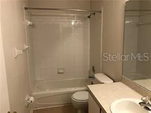 a view of a hallway with a door