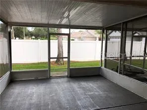 a view of a room with a wooden floor and a window